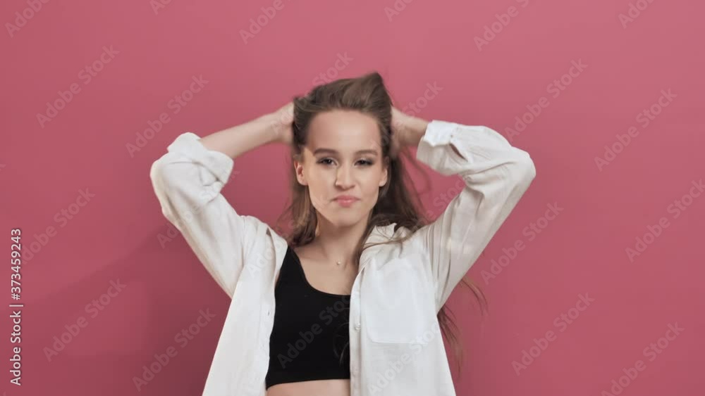 Young Pretty Woman with Long Hair Shaking Her Head Smiling Dancing to Music Rhythmically to Beat. Teenage Girl Dancing Music Dance Concept, Slow Motion Young Pretty Woman with Long Hair Shaking Her Head Smiling Dancing to Music Rhythmically to Beat. Teenage Girl Dancing Music Dance Concept, Slow Motion