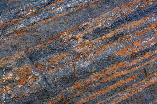Texture of the stone with layers of iron ore
