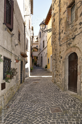 A small street between the old houses of Giuliano di Roma, of a medieval village in the Lazio region, Italy. 