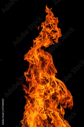 Fire flame isolated over black background, abstract texture