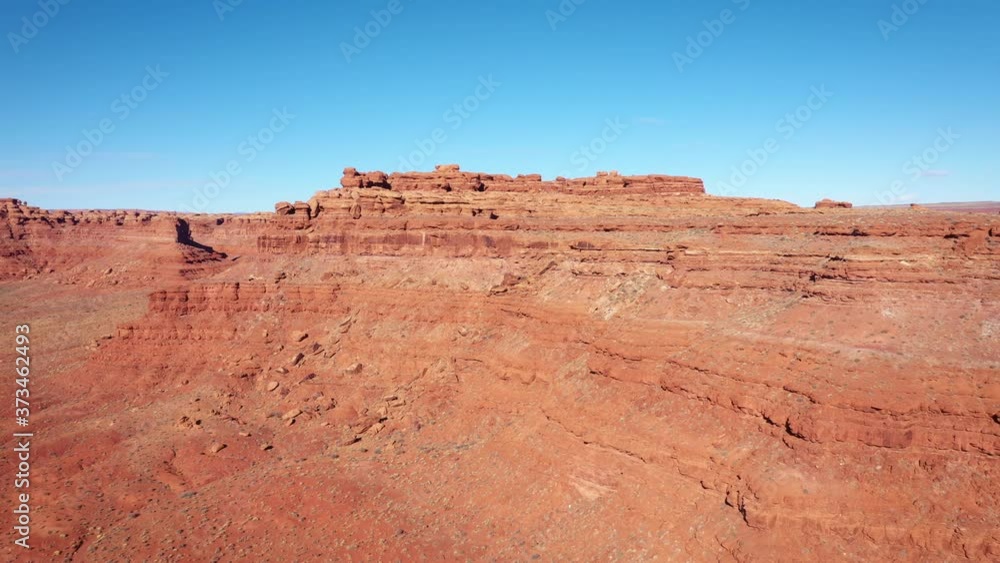 Aerial Shot Of Arid Desert With Red Sand And Crumbling Rock Formations In Gorge Aerial Shot Of Arid Desert With Red Sand And Crumbling Rock Formations In Gorge