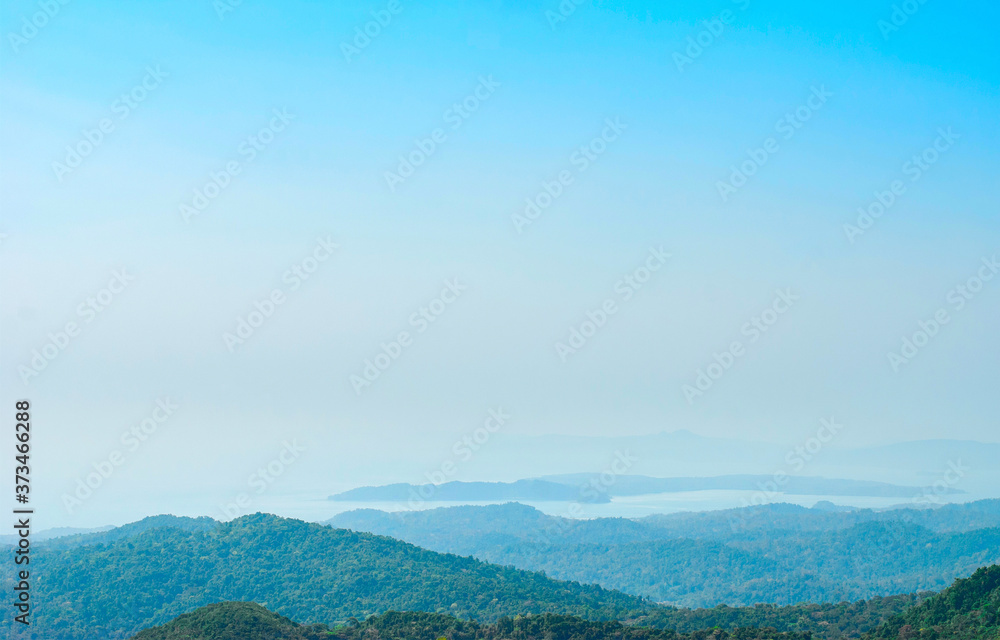 Panoramic view of the mountainous tropical coast covered with rainforest