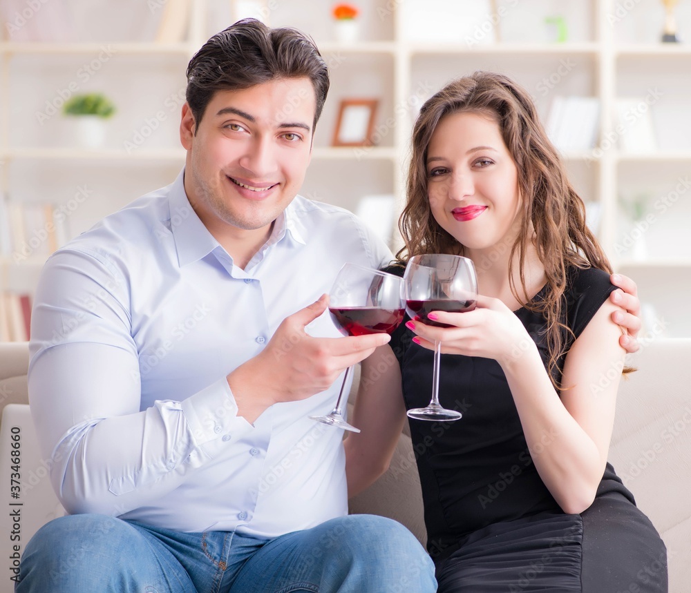 Young pair drinking wine in romantic concept Young pair drinking wine in romantic concept
