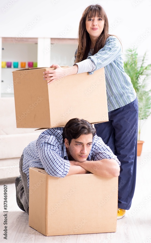 Young family moving in to new apartment after paying off mortgag Young family moving in to new apartment after paying off mortgag
