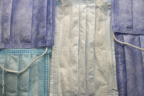 Background layering of disposable surgical face mask for virus protection