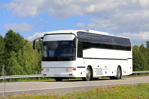 White Bus on Summer Highway.