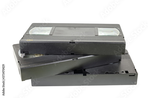 Black VHS video tape cassettes on white background