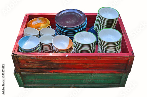 Colored ceamic cups in red box on white background photo