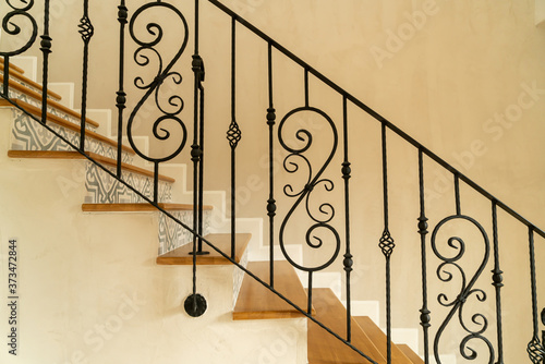 Fotobehang stair step with black handrail