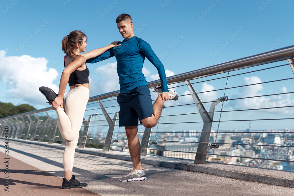 Man and woman making sport training outdoors together Man and woman making sport training outdoors together