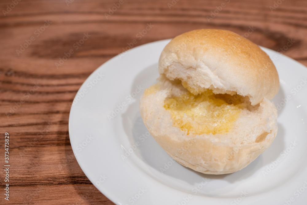 Bun Bread and Butter on wooden table. Bun Bread and Butter on wooden table.