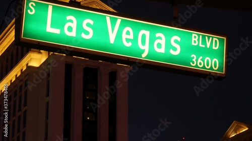Fabulos Las Vegas, traffic sign glowing on The Strip in sin city of USA. Iconic signboard on the road to Fremont street in Nevada. Illuminated symbol of casino money playing and bets in gaming area