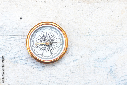 round compass on abstract background as symbol of tourism with compass, travel with compass and outdoor activities with compass