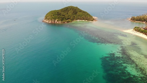 Wallpaper Mural Aerial drone view small Koh Ma island, Ko Phangan Thailand. Exotic coast panoramic landscape, Mae Haad beach, summer day. Sandy path between corals. Vivid seascape, mountain coconut palms from above. Torontodigital.ca