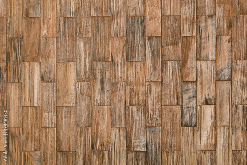 background and texture of brown color decorative old wood on surface wall in rectangular shape.