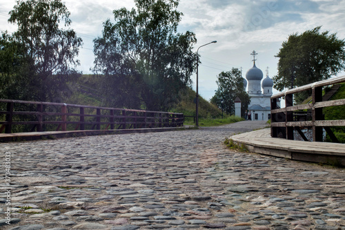 Scenic view of old Spaso-Preobrazhensky cathedral in Belozersk. Beautiful summer sunny look of ancient orthodox temple in historical center of ancient town in Vologodskaya oblast in Russian Federation photo