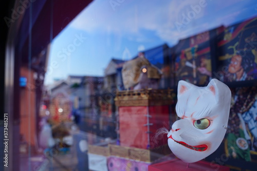 Japanese old style fox and okame face masks are in show window in Kawagoe, old edo town, Japan.
