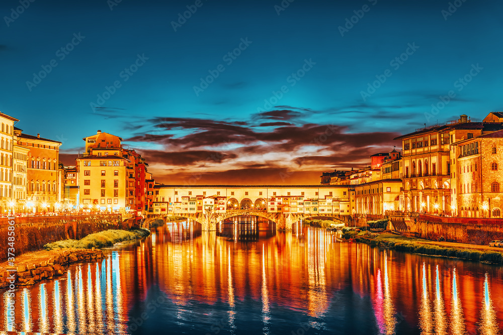 Beautiful landscape, panorama on historical view of the Florence - Ponte Vecchio is a bridge in Florence at night time. Italy.