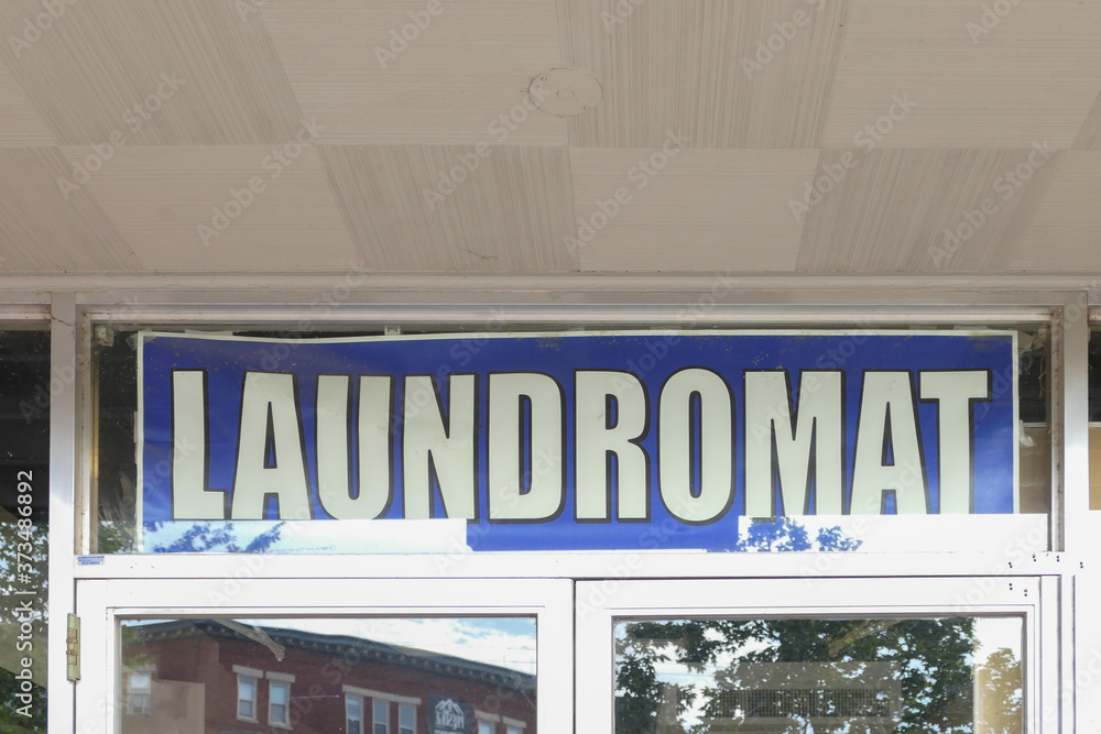 Laundromat sign in a window