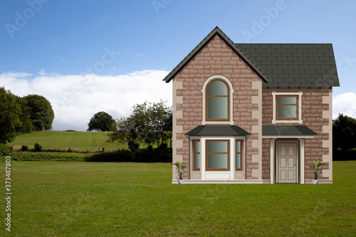 Picturesque rural scene with detached residential house and garden