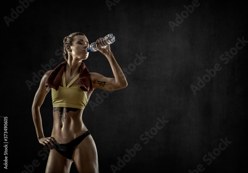 Wallpaper Mural young fitness woman with bottle water Torontodigital.ca