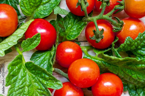 cherry tomatoes on wooden table background