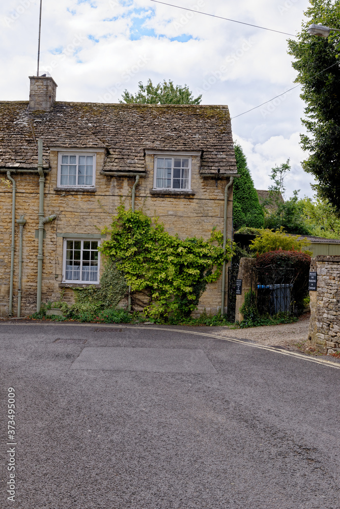 Pretty Cotswold stone cottages in the Cotswold village of Burford in Oxfordshire - United Kingdom