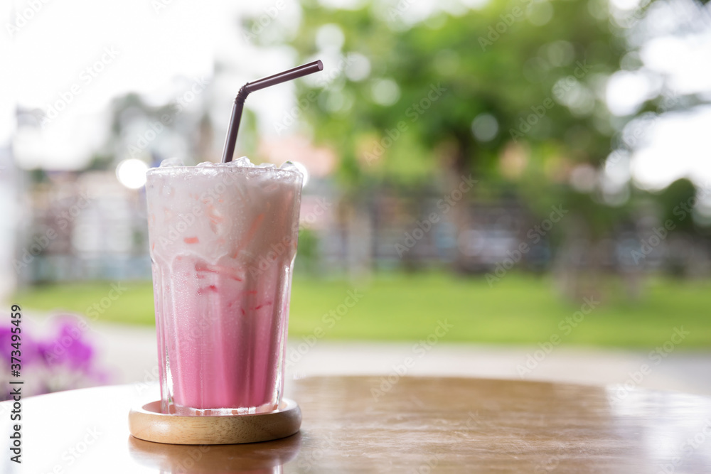 Beverage of Juice for Summer put on the table. Pink strawberry milkshake. Strawberry smoothie or milkshake for healthy dessert. Pink milk in glass. Beverage of Juice for Summer put on the table. Pink strawberry milkshake. Strawberry smoothie or milkshake for healthy dessert. Pink milk in glass.