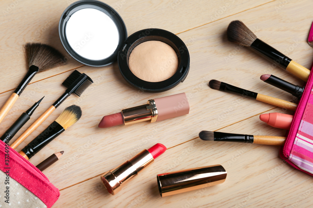colorful cosmetic background with make up brushes and products colorful cosmetic background with make up brushes and products