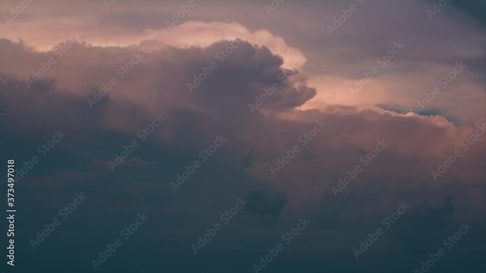 Dramatic storm clouds moving in reverse 4k timelapse evening sky Dramatic storm clouds moving in reverse 4k timelapse evening sky