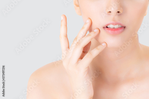 Closeup beautiful woman asian makeup of cosmetic  girl hand touch cheek and smile attractive  face of beauty perfect with wellness isolated on white background with skin healthcare concept.