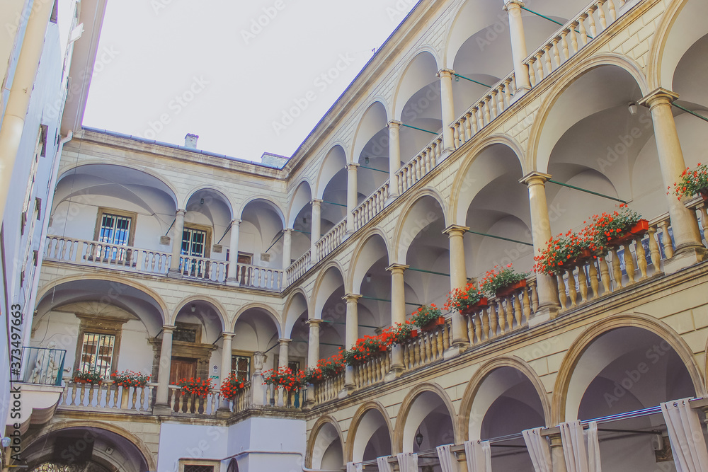 LVIV, UKRAINE - JULY 09, 2018: General view of Italian Courtyard in Lviv City. Arched vaults