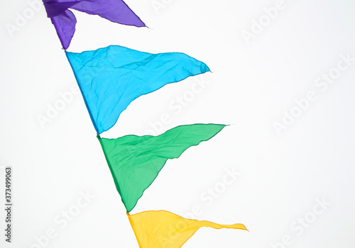 Billede på lærred Fairground triangle flag hanging on a rope for a fun party Fiesta event, carniva