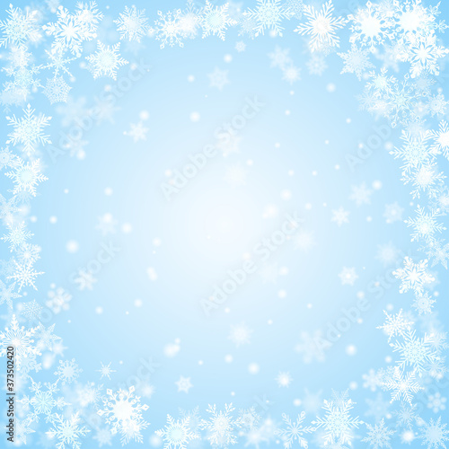 Christmas background of snowflakes arranged in a circle, in light blue colors © Olga Moonlight