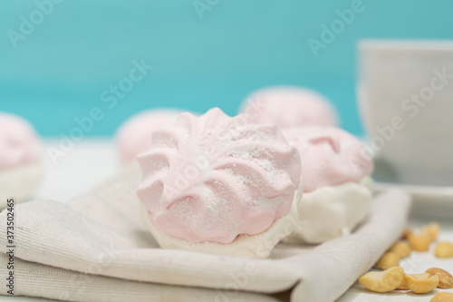 healthy sweets with pectin. delicate marshmallow on a blue light background