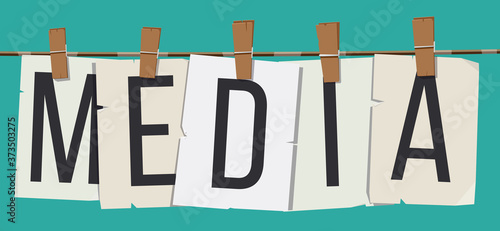 Word "Media" attached with hairpins