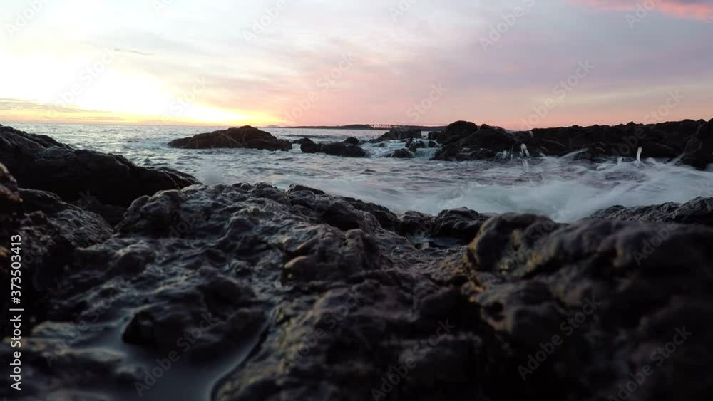 Uruguay, Punta Ballena Beach. Near by Casapueblo. Time lapse at afternoon. Stones, ocean, sunset, waves, sky, sun. Uruguay, Punta Ballena Beach. Near by Casapueblo. Time lapse at afternoon. Stones, ocean, sunset, waves, sky, sun.