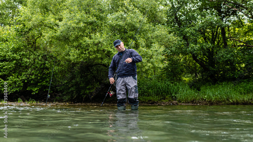 Fishermen by the river stock photo