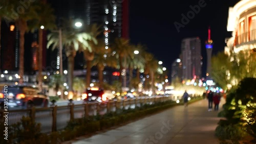 Defocused fabulous Las Vegas Strip boulevard, luxury casino and hotel, gambling area in Nevada, USA. Nightlife and traffic near Fremont street in tourist money playing resort. Neon lights of sin city.