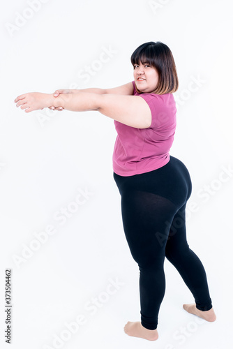 Asian fat woman Stretching arms to relax muscles after exercise To lose weight On white background, concept to People and health care with exercise
