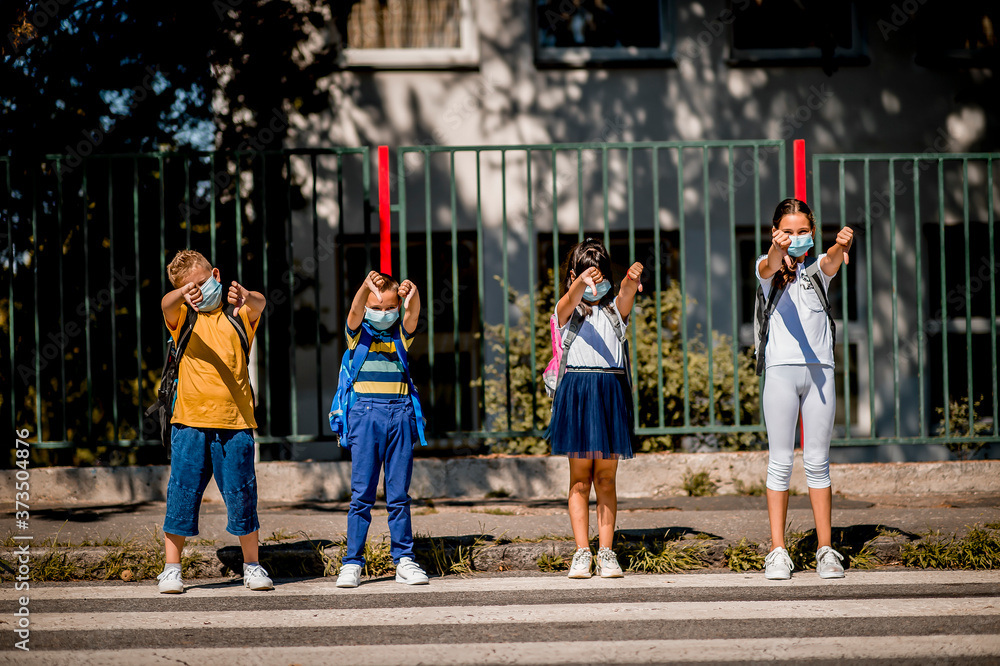 Children going back to school after epidemic, They are wearing a protective face mask Children going back to school after epidemic, They are wearing a protective face mask
