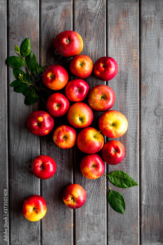 Ripe red apples with leaves - top view, copy space