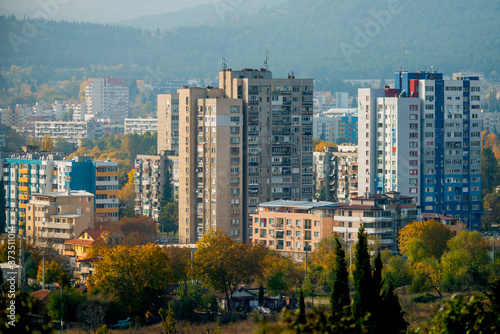 Eastern European panel buildings / blocks / housing estates revealing a beautiful mountain scenery.