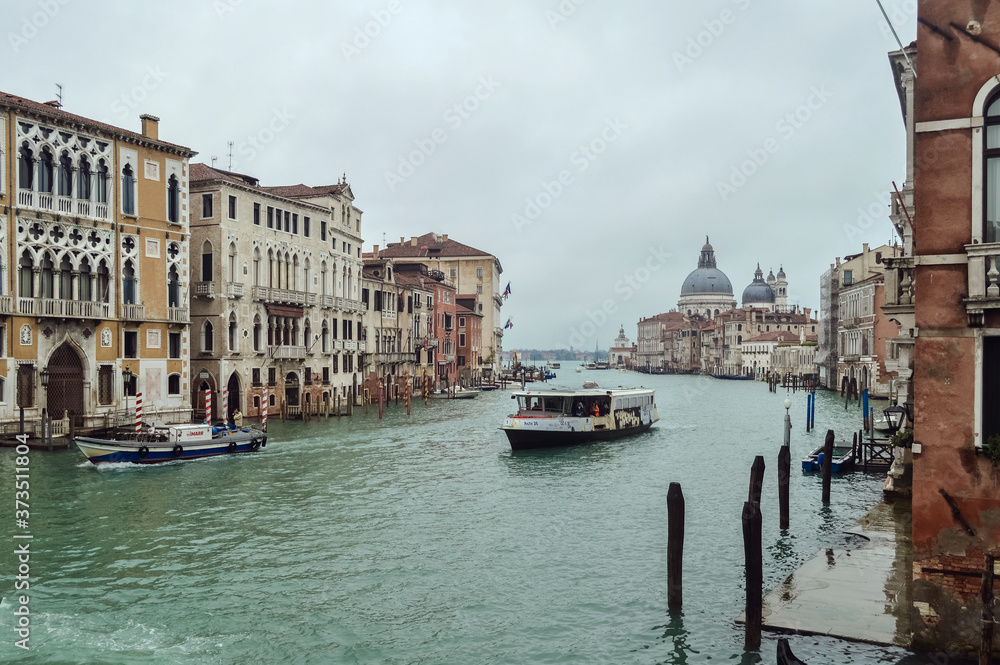 View of the Grand Canal, ancient palaces and the Church of Santa Lucia della Salute in Venice.