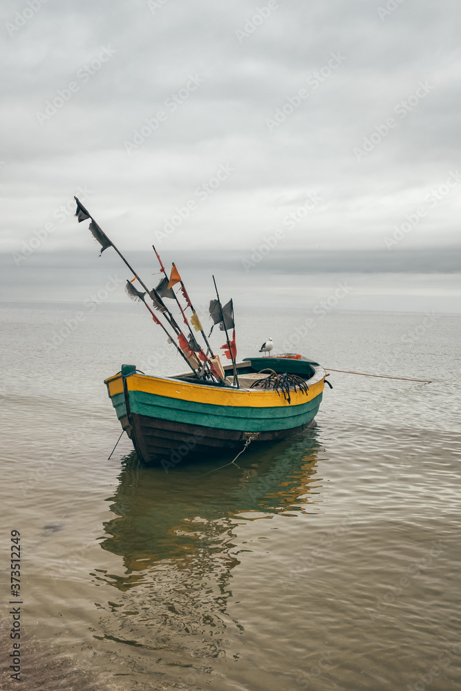 Wooden fishing boat in Baltic Sea in Poland Wooden fishing boat in Baltic Sea in Poland
