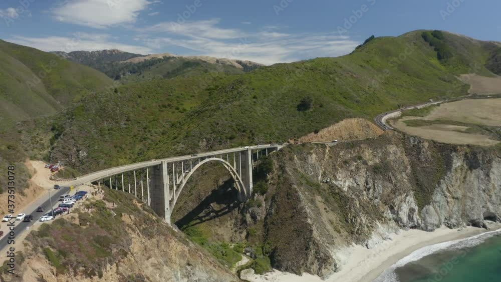Aerial View of Bixby Creek Bridge with Tourists' Cars in Parking Lot Aerial View of Bixby Creek Bridge with Tourists' Cars in Parking Lot