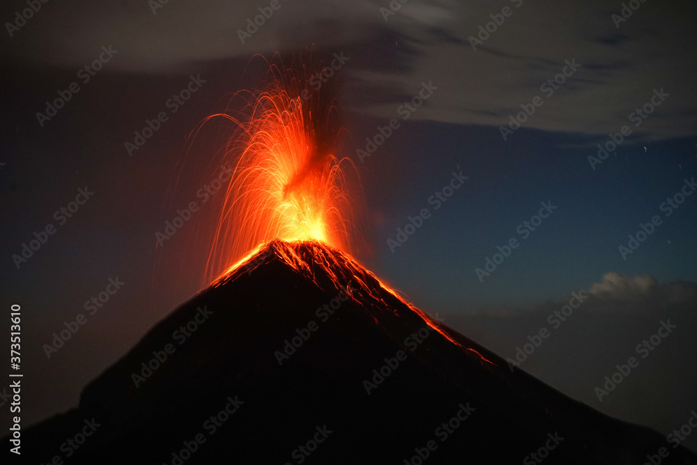 Fuego volcano erupting at night in antigua guatemala