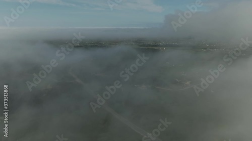 Wallpaper Mural Aerial view of Magdalen Island village through transparent gray clouds Torontodigital.ca