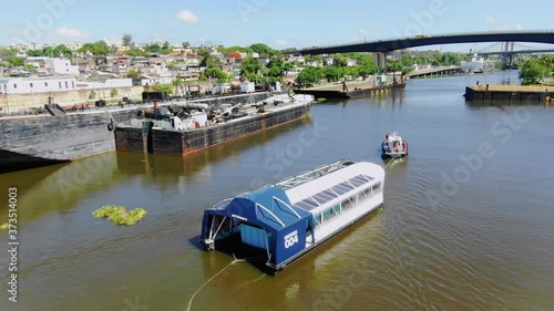 Scenic shot of interceptor 004 cleaning up the Ozama River in the Dominican Republic