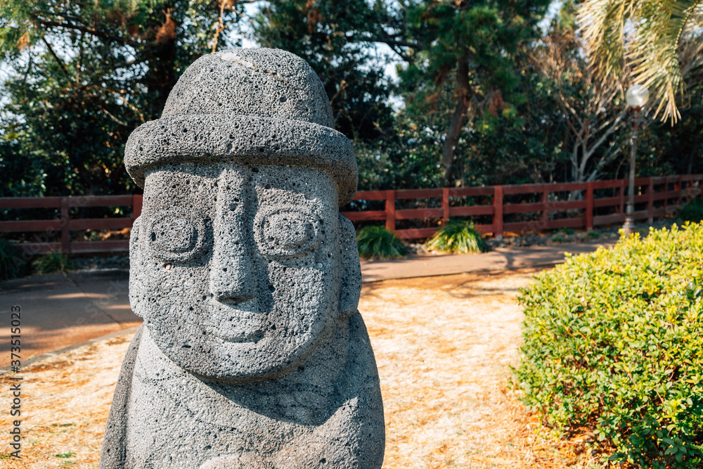Dol hareubang stone grandpa sculpture at Daepo Jusangjeolli park in Jeju Island, Korea
